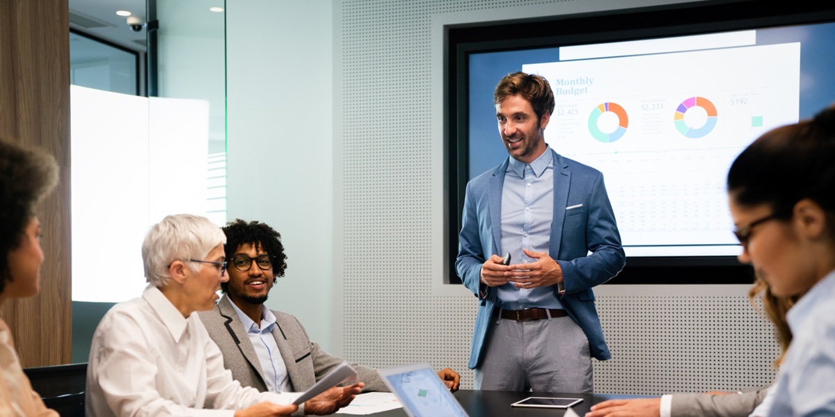 A man giving a presentation in a conference room
